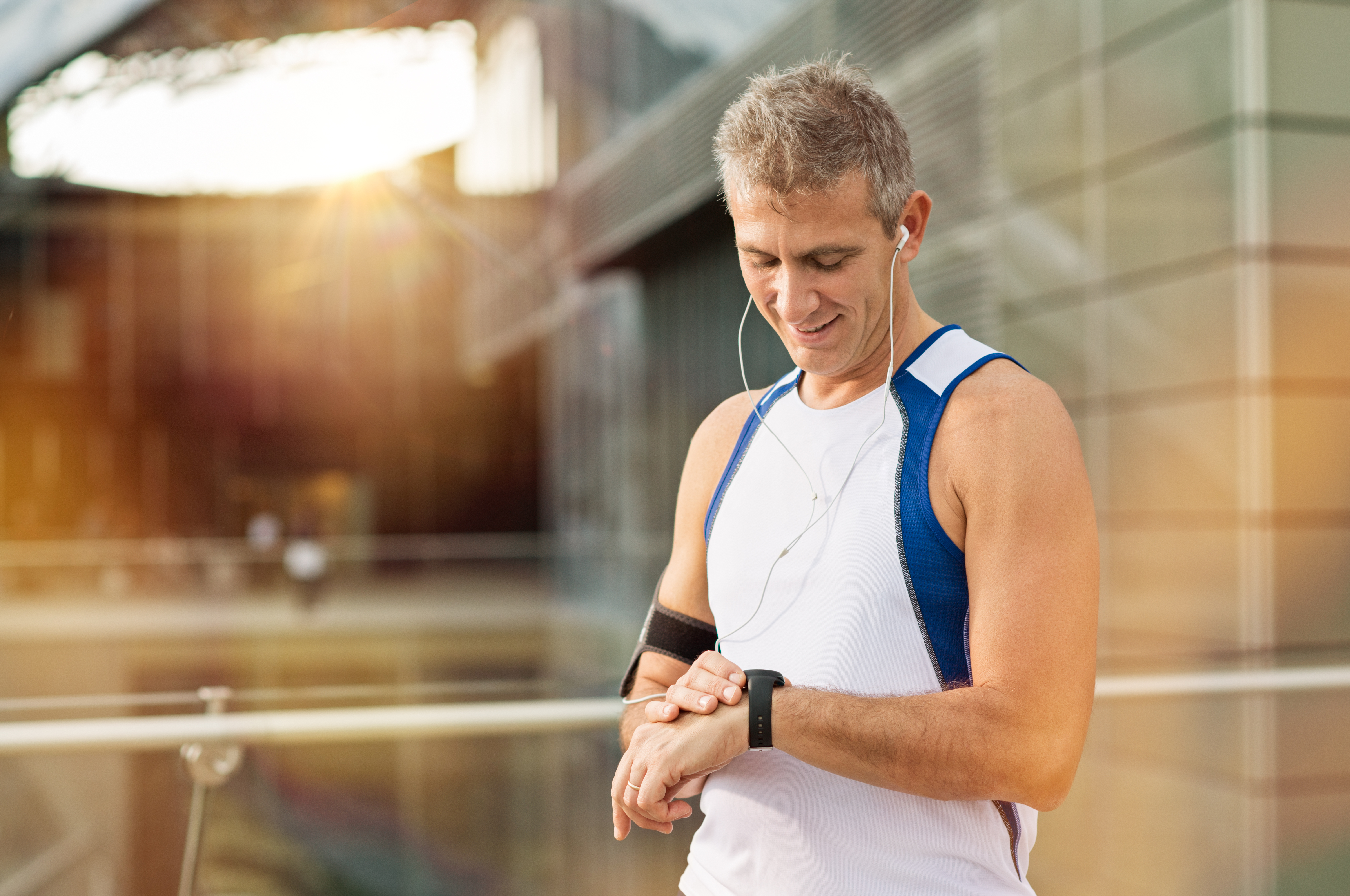 male athlete looking at watch